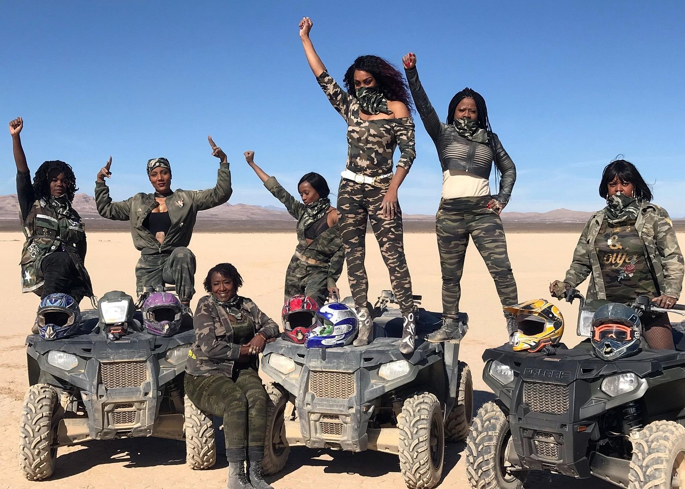 Group of riders celebrating on ATVs in the Las Vegas desert